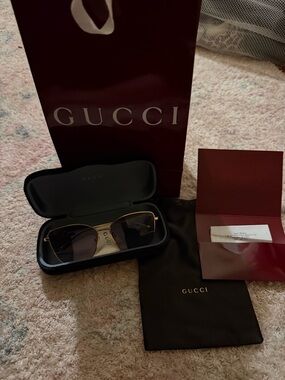 Gucci Gold Frame Sunglasses with Dark Lenses
